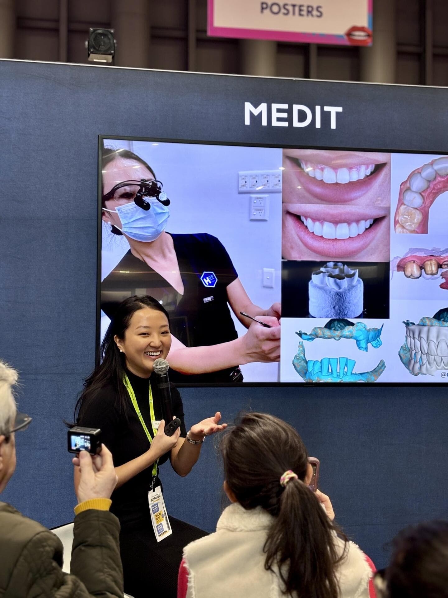View photograph 4 of 7: Dr Alice Whang presenting digital dentistry workflows to an audience at the Medit stand